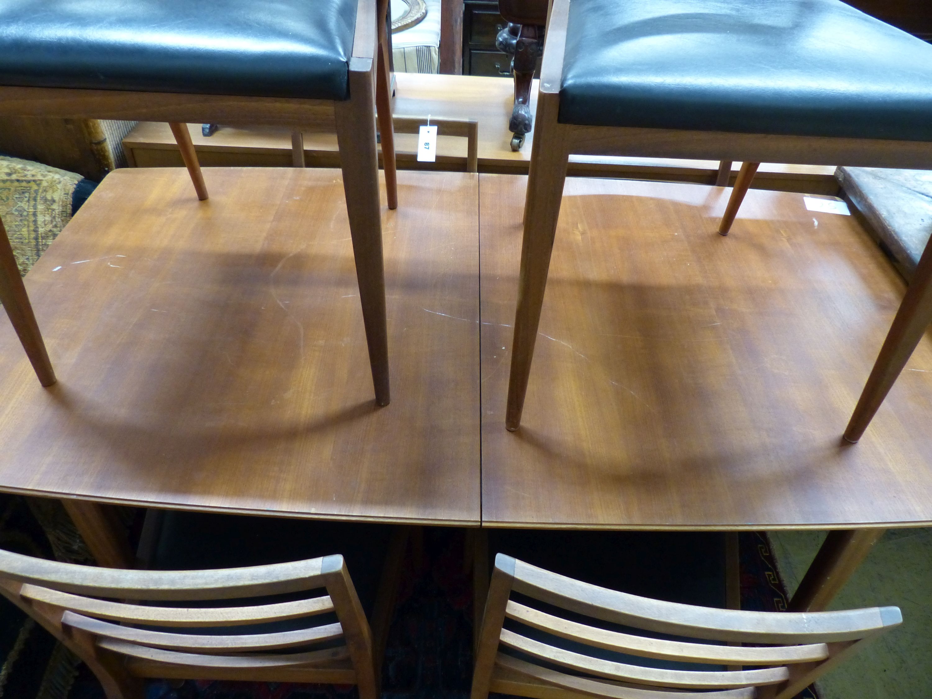 A mid century H McIntosh, extending teak dining suite comprising of table, six chairs and sideboard